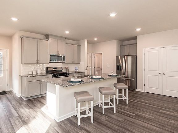 Photo of model home for illustration purposes only, the actual home has white cabinets