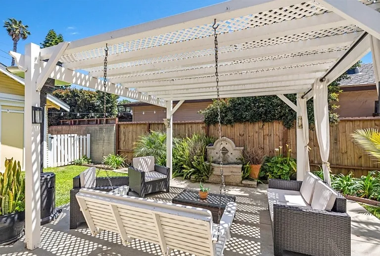 Side patio with waterfall feature. Perfect for entertaining.