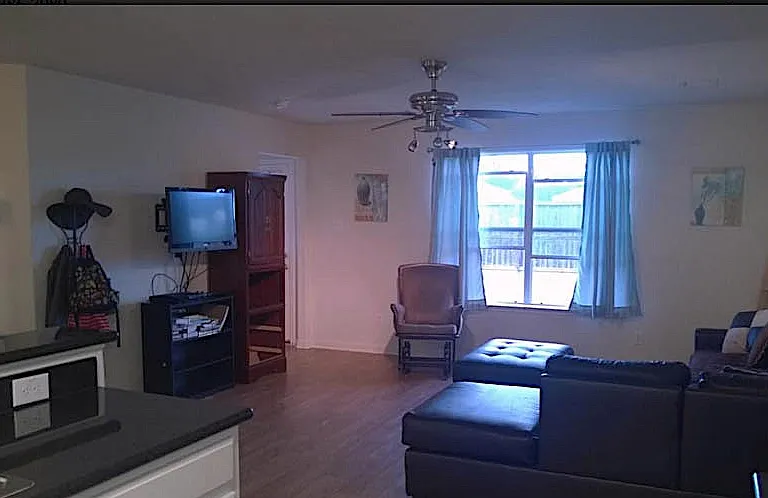Kitchen has White On Black Cabinet and Stone Counter Tops
