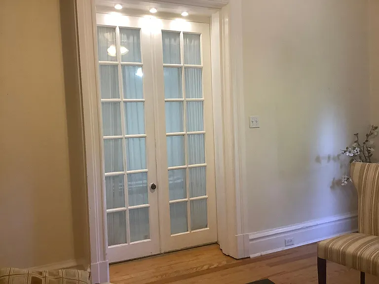 French doors leading to first bedroom