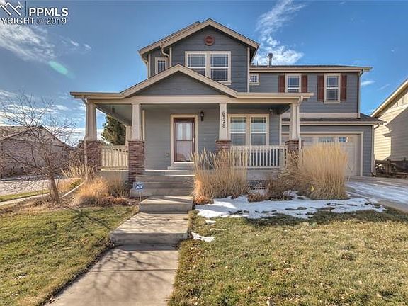 Front view of home with wrap around porch