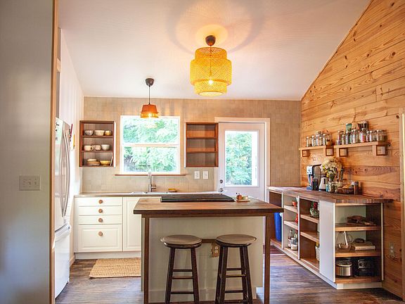 Kitchen view from front entrance facing back door