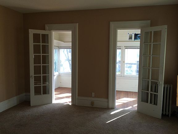 Two door leading out to enclosed porch