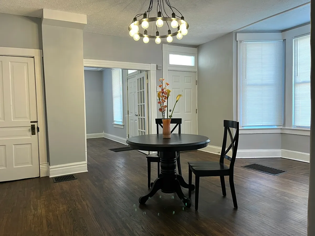 Photo 2 of 13 - 791 Campbell Ave - Columbus, OH Large main floor rooms _ lights on, french doors open. - 791 Campbell Ave