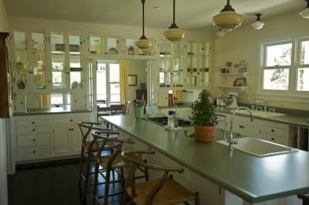 Cleverly designed kitchen gives cook a beautiful view thru DR.