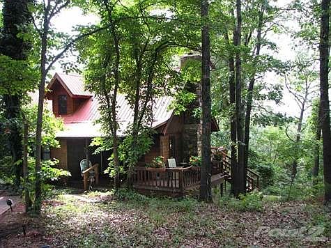 Covered Front Porch and Side Deck in summer