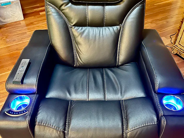 This electric recliner includes lumbar support, two cup holders and a phone charger. It even lights up!