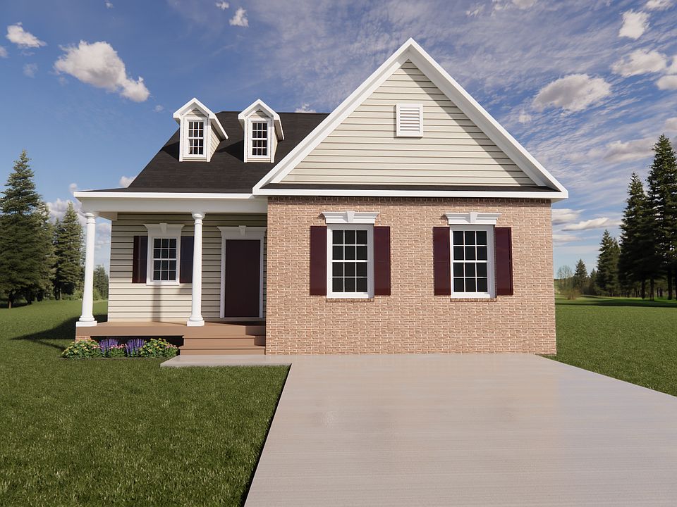 Nestled in Poplar Village, this charming small house features a blend of brick and siding, complete