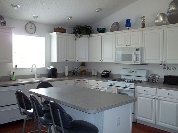 Large open kitchen with updated gas appliances and large eat-in island