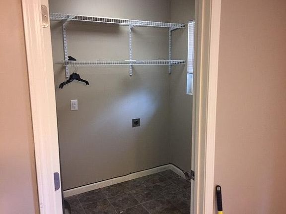 laundry with washer/dryer connections and shelving/cabinet