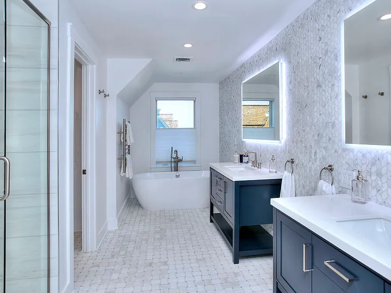 Spa like bath with standing shower and soak tub, heated floor, dual vanities, towel warmer and water closet with smart bidet toilet.