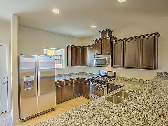 Gorgeous kitchen INCLUDES granite counters and stainless steel appliances