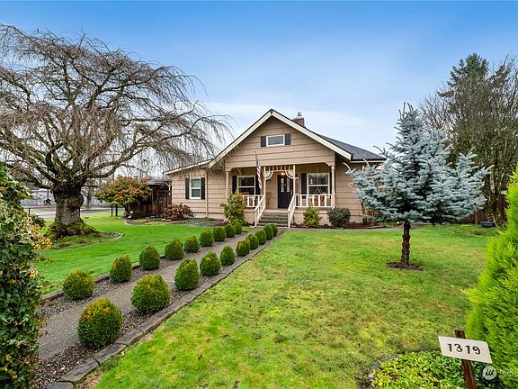 Nestled on a shy, quarter acre fully fenced lot with gorgeous established trees and shrubs - this is the perfect spot for the gardening enthusiast or to simply let your people & pets play!>