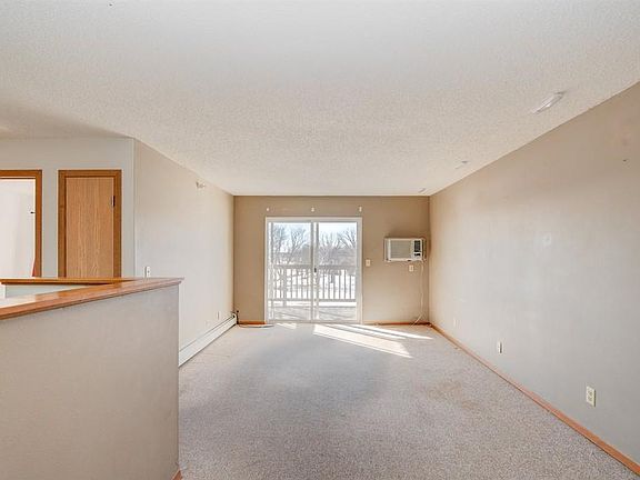 REMEMBER -- THIS IS BEFORE! Unit is being repainted and new floor coverings and window treatments are being installed.