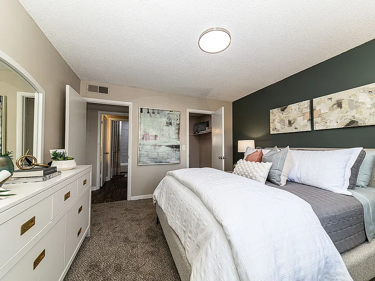 Cozy bedroom with carpet and overhead lighting