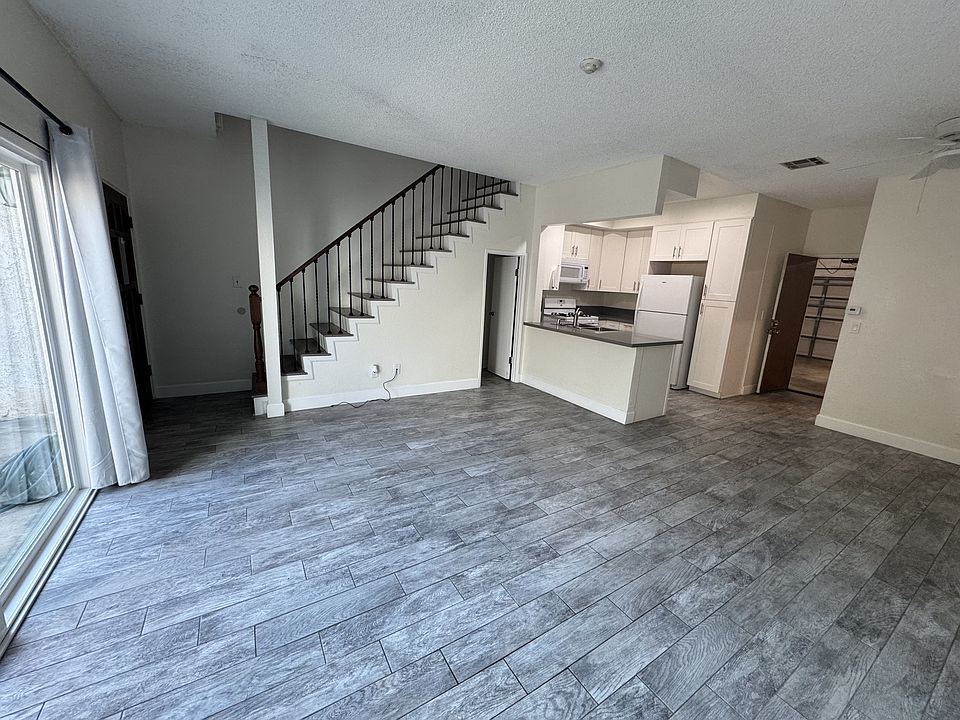 Living room - note open floor plan kitchen and dining area