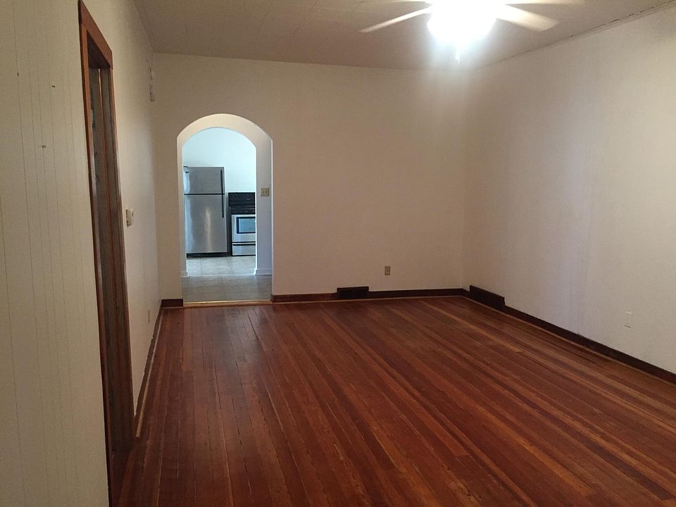 Wood floors. Stainless stove & refrigerator