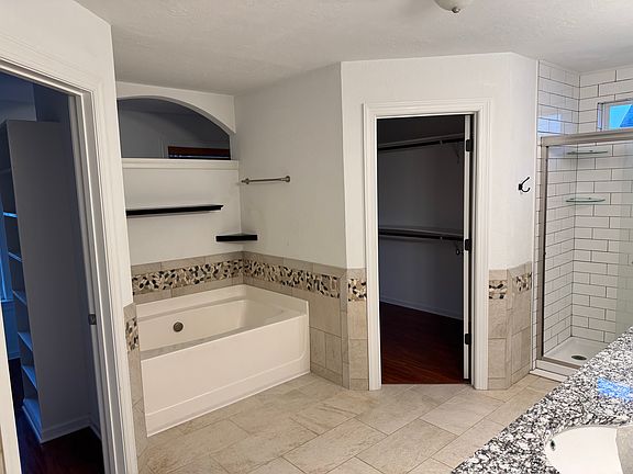 Master Bath with His & Her Closets
