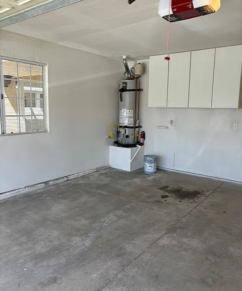 garage has automatic door opener and room for 1 car and a golf cart, polaris, motorcycle