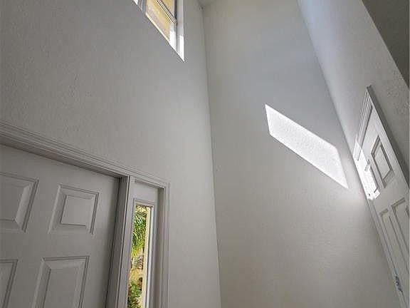 entrance with large storage closet & garage entrance door