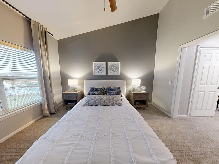 The primary bedroom of The Cedar floor plan flows to a dedicated changing area and closet. The primary bedroom of The Cedar floor plan flows to a dedicated changing area and closet.