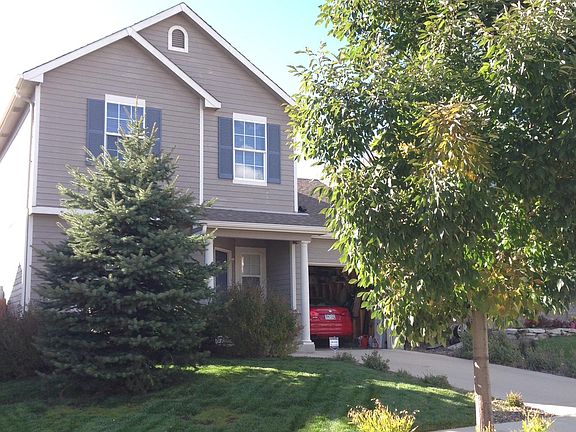 Well-kept landscaping with mature trees