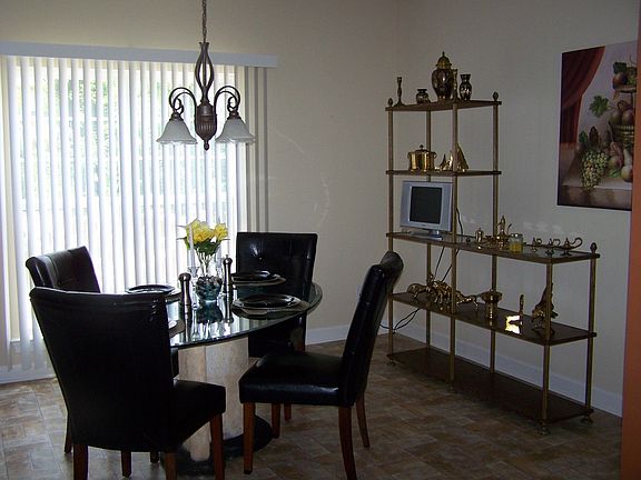 Breakfast nook looks into tree lined backyard