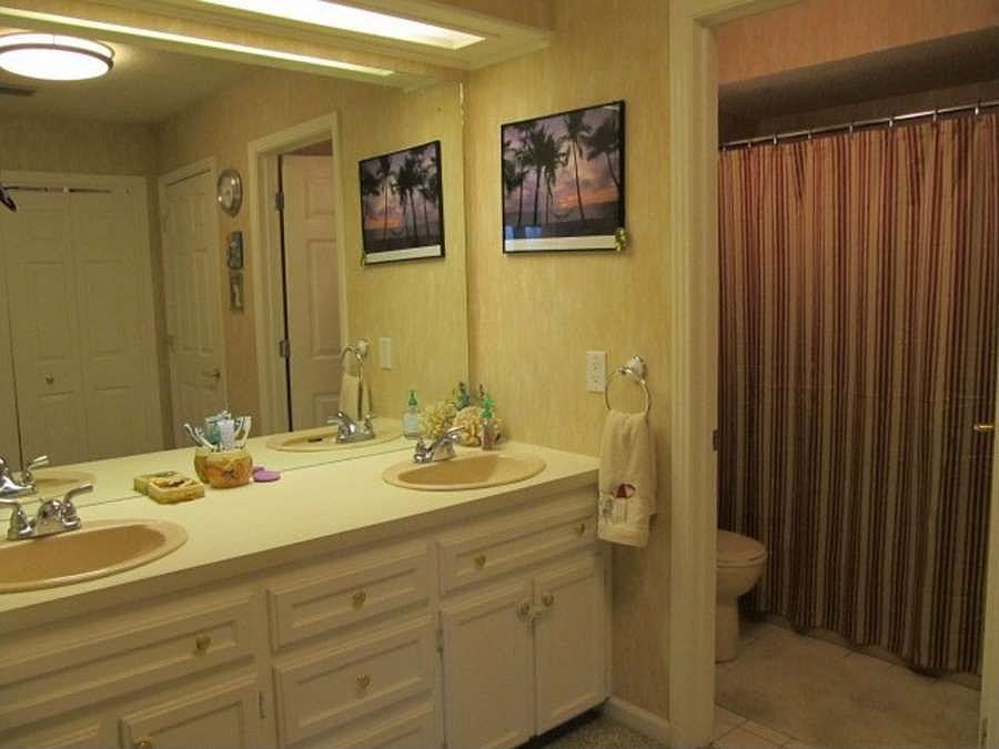 "Master bathroom with separate areas"