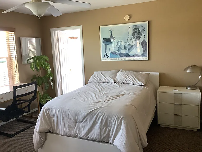 Upstairs front bedroom with private bath and walk-in closet.