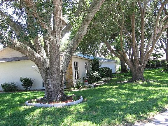 large yard has mature shade trees
