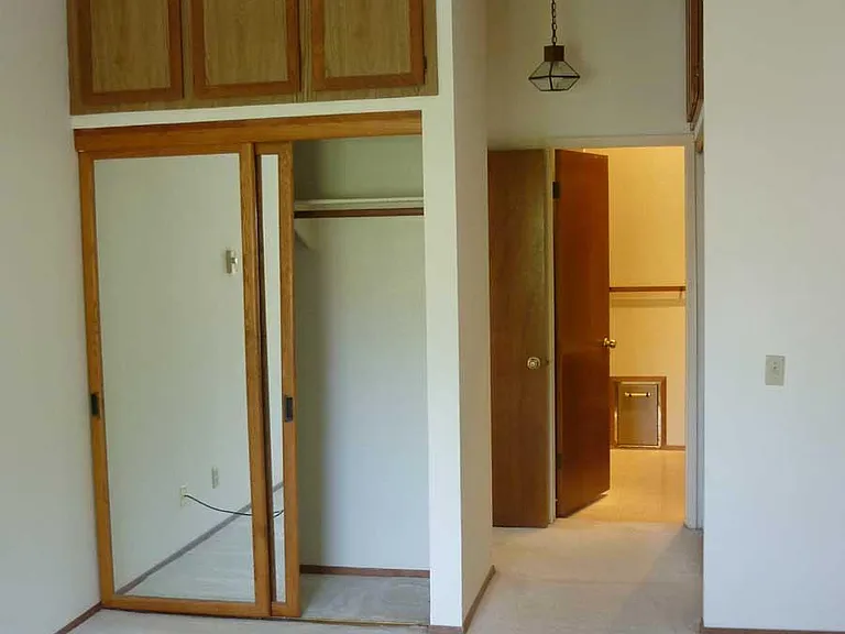 West bedroom, looking south. Small panel in distance is built-in scale.