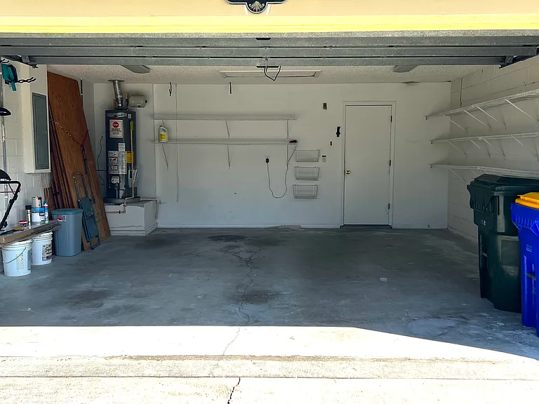 Garage with Wire Shelving and Attic for Storage
