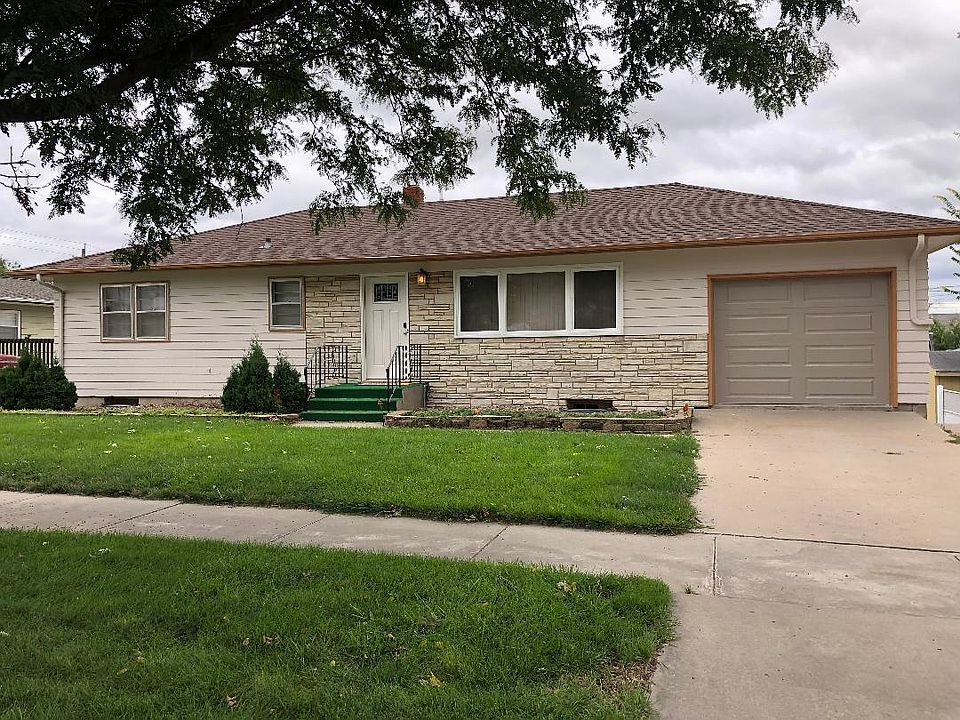 Exterior of the duplex. Unit A is on the main floor, and enters from the front. Unit B is on the lower level, and enters from the alley.