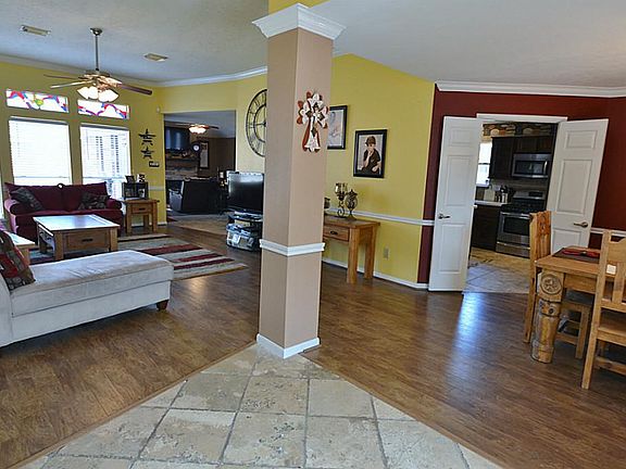 Entry to the home is beautiful tile work and open the family room and formal dining room with gorgeo