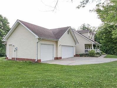 Exterior Front. Three car garage for all your cars & toys.