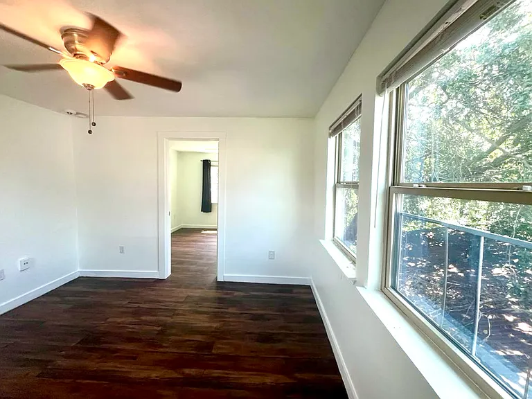Living room looking into the secondary bedroom/office
