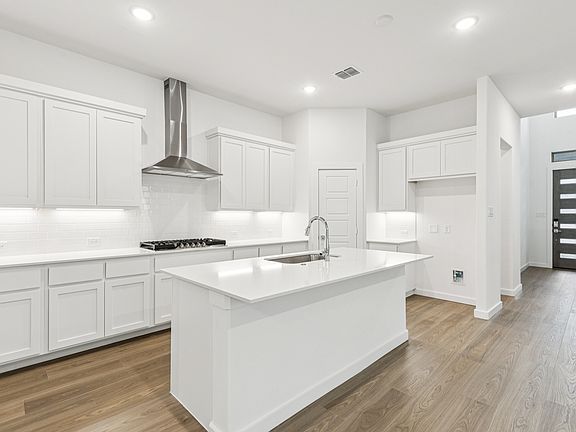 Kitchen in the Picasso II home plan by Trophy Signature Homes - REPRESENTATIVE PHOTO
