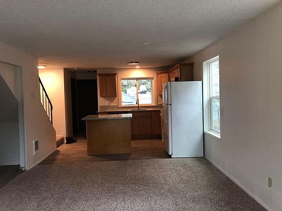 Open concept kitchen, dining and living room