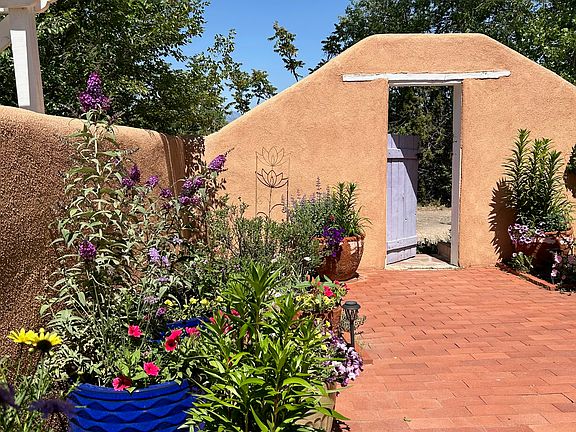 Entrance and walled patio for the Nambe Casita in the summer.