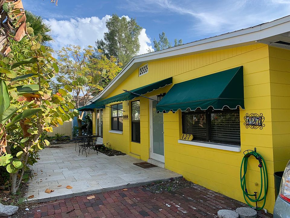 Front of house and travertine patio