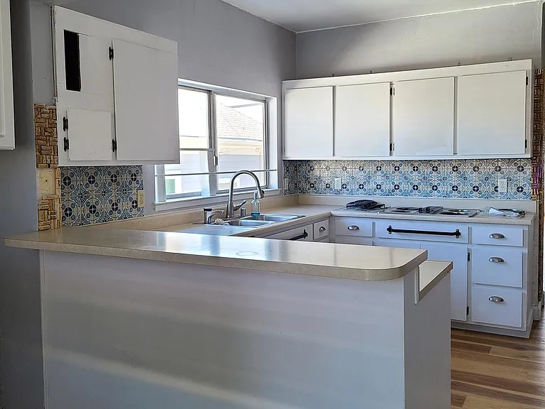 Breakfast bar in spacious kitchen.