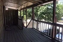 Please respond quickly as this unit won't last long. Relax in privacy on your own personal deck with a view. Lots of beautiful shade trees. Park at the foot of the stairs to your entry. Front and back entry