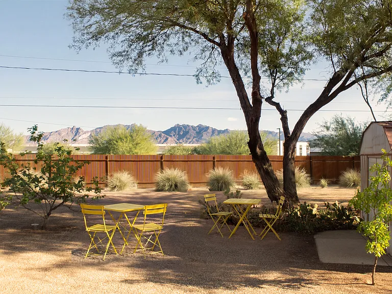 Catalina Mountain views from the yard's shady corner bistro seating tucked under the mature mesquite tree.