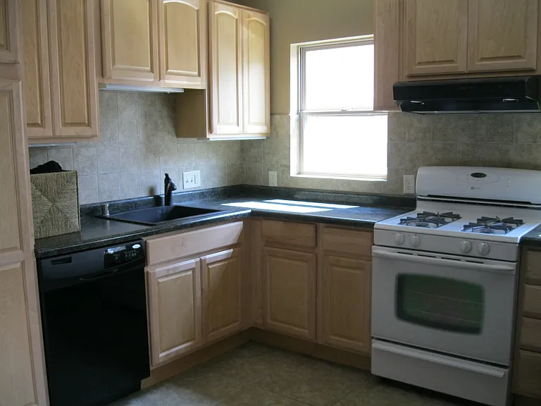 remodeled kitchen including a dishwasher and desirable gas stove.