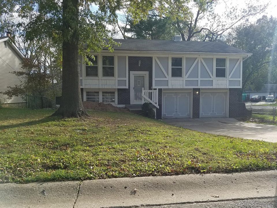 Front of Home with Huge Trees and Large Fenced Yard