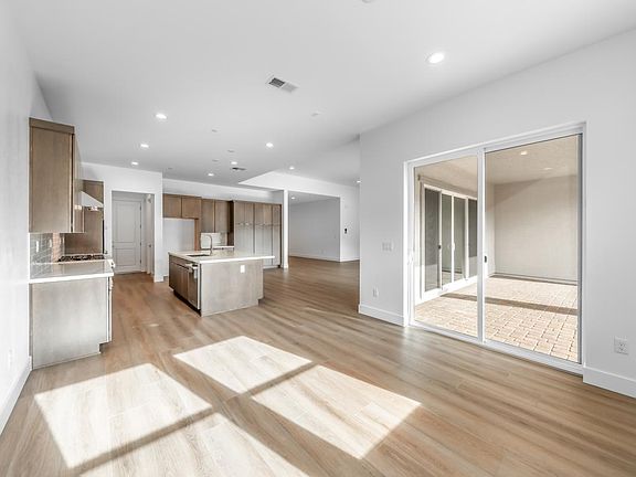 Casual dining area adjacent to kitchen and access to covered patio
