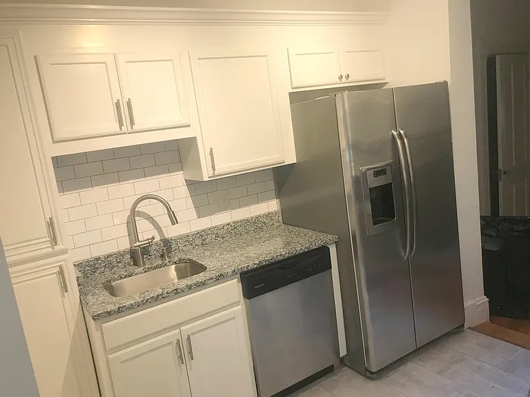New stainless appliances, fridge with in-door icemaker. New white cabinets