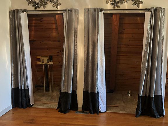 Utility area with curtains for washer/ dryer