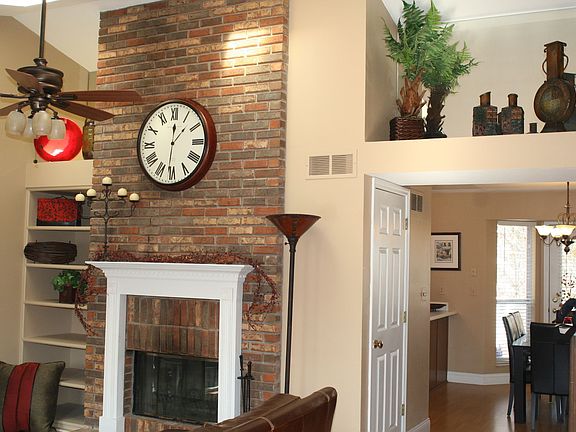 Great Room w/Vaulted Ceilings, Skylights & Soaring Fireplace!