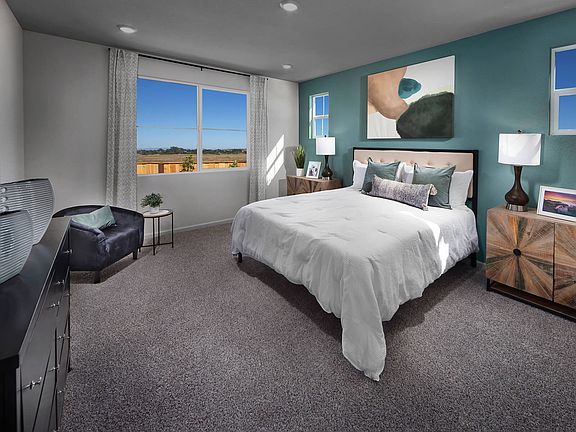 Residence 2 primary bedroom modeled at a nearby Meritage community.